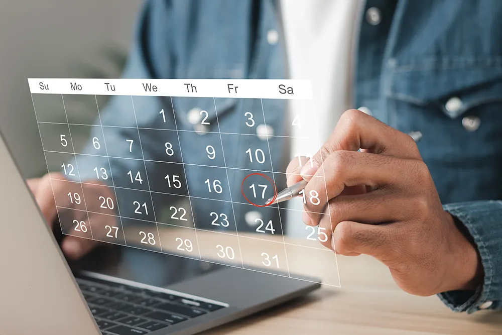 a man marking his calendar